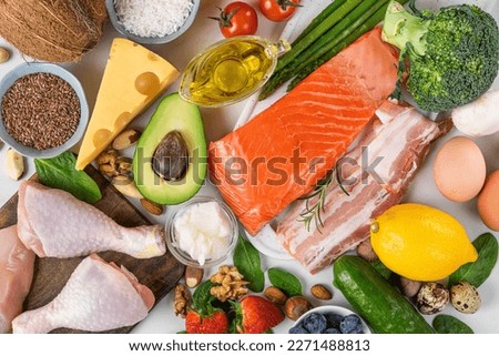 Balanced low carb keto diet food. Food sources of protein, healthy fats, carbs. Top view. Fish, meat, vegetables, fruits, nuts, eggs for ketogenic diet Royalty-Free Stock Photo #2271488813
