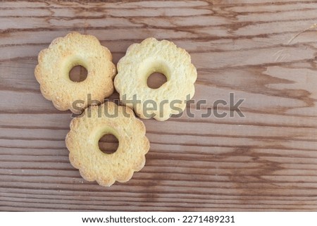Butter cookies on wooden table background, top view, copy space.