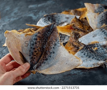 Salted dried horse mackerel, yellow minke fish. Fish appetizer for beer. Stockfish