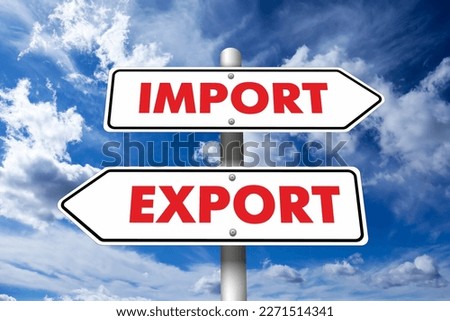 Road sign with Import and Export words on arrows pointing in opposite directions against sky