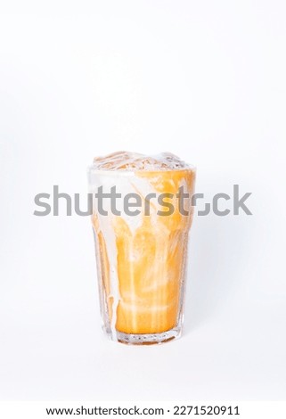Thai iced tea is a very popular drink on white background, taking the 7th place as the most delicious non-alcoholic drink in the world.
