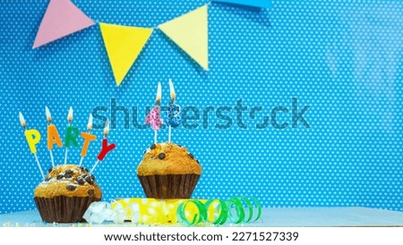 Festive muffin pie with candles for a birthday. Birthday background with numbers  48. Anniversary card on blue polka dot background, copy space