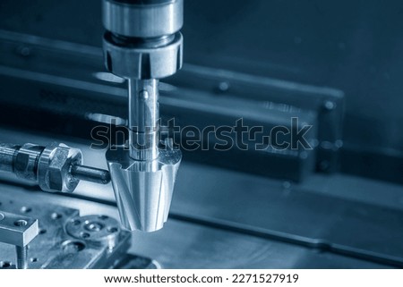 Close up operation of the sinker EDM machine. The mold and die manufacturing concept by EDM machine. Royalty-Free Stock Photo #2271527919