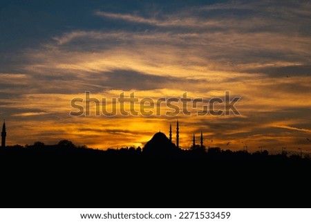 Suleymaniye Mosque and dramatic clouds at sunset. Ramadan or islamic concept photo. Silhouette of Istanbul.