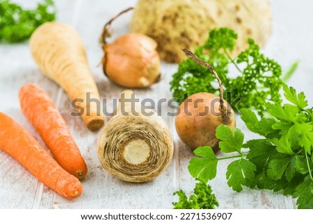 Vegetables and herbs for vegetable stock, soups, vegetable broth. Healthy and homemade food concept.