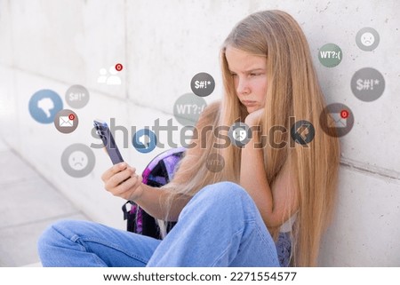 Sad girl viewing negative reactions and comments on social media, concept of children online bullying. Royalty-Free Stock Photo #2271554577