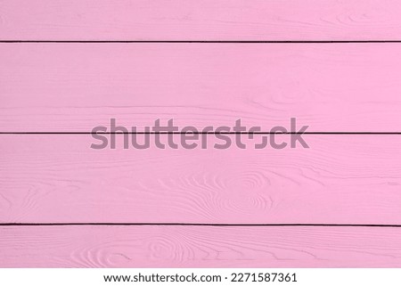 Texture of pink wooden surface as background, closeup