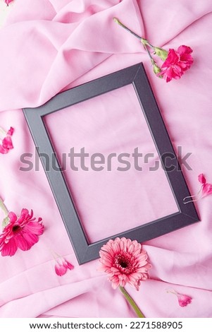 Aesthetic empty floral flat lay frame among gerberes, asters flowers with copy space. Concept of Mothers Day, Womens Day, invitation card, wishing card.