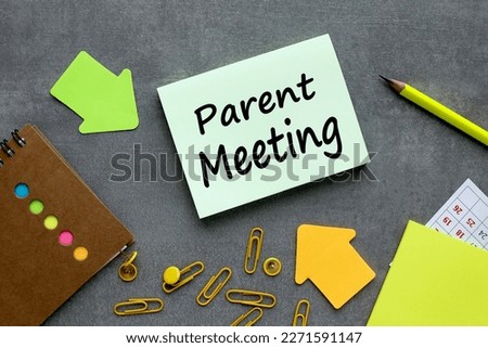 PARENT MEETING. text on green sticker. on a gray background near bright stickers and paper clips Royalty-Free Stock Photo #2271591147