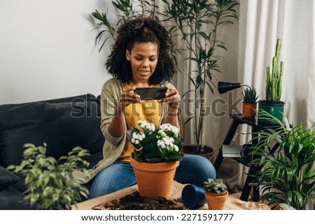 Florist is photographing her work with a cellphone