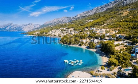 The beauty of the coastline and beach near Brela, Baška Voda, Croatia has been captured from above.