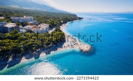 The beauty of the coastline and beach near Brela, Baška Voda, Croatia has been captured from above.
