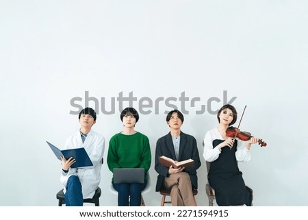 Thinking group of college students from various departments. Faculty of Science, IT, literature, Music. Royalty-Free Stock Photo #2271594915