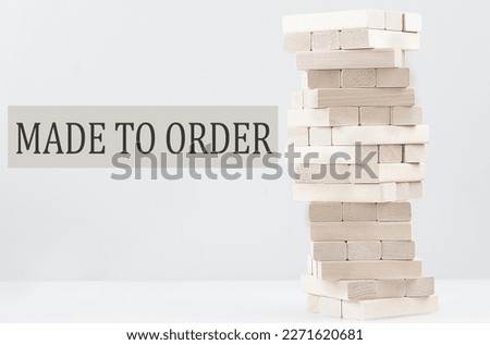 Text MADE TO ORDER on a wooden pencil on white keyboard. Business concept