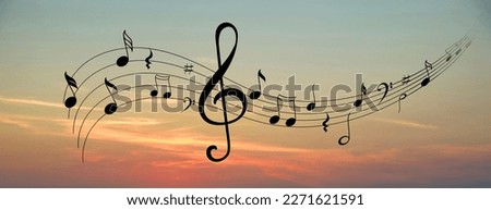 Staff with treble clef and musical notes against sunset sky, banner design Royalty-Free Stock Photo #2271621591