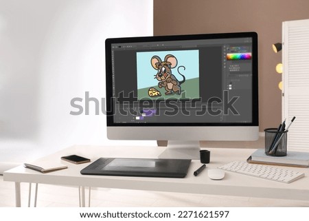 Animator's workplace. Modern computer with illustration on screen