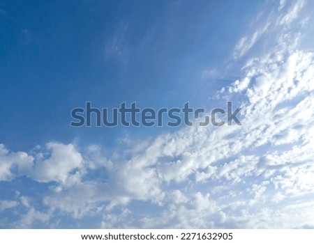 Beautiful white clouds and blue sky background. Blue sky with multitude small clouds in daylight. Tiny soft white clouds in the blue sky. Small clouds in clear blue sky. Nature concept background
