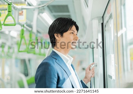 Young Asian businessman working in the business district