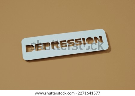 a paper sign with the text depression placed on a brown background Royalty-Free Stock Photo #2271641577