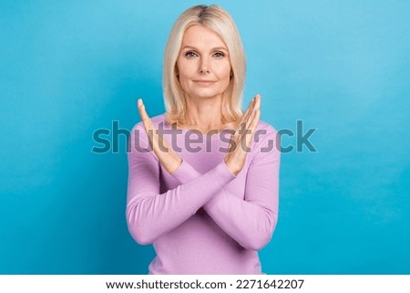 Photo of serious confident lady wear trendy clothes crossed two arm demonstrate refuse unhealthy life isolated on blue color background