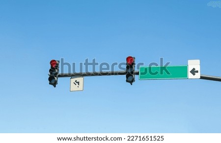 Traffic lights against blue sky. Road rules