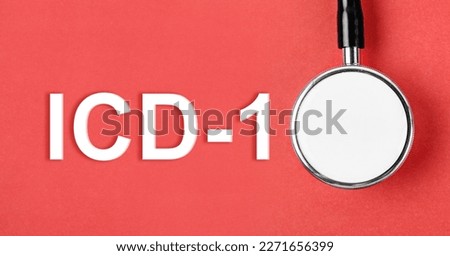 ICD-10 or International Classification of Diseases and Related Health Problem 10th Revision text and medical stethoscope on red background.
