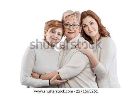 Adult daughters hugging with mom. Family in beige sweaters. Love and tenderness. Isolated on a white background. 
