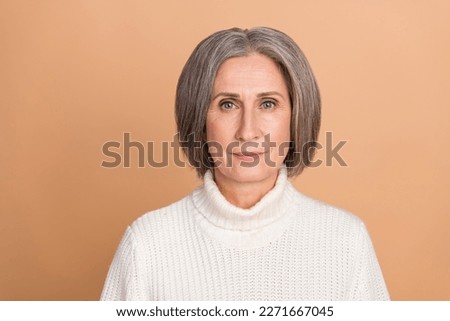 Portrait photo of mature aged pensioner attractive woman wear stylish white turtleneck confident serious person isolated on beige color background Royalty-Free Stock Photo #2271667045