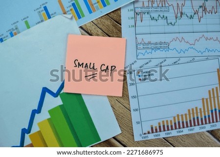 Concept of Small Cap write on sticky notes isolated on Wooden Table.
