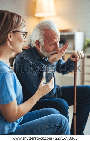 Female GP doctor giving pills to older male patient at appointment. Practitioner prescribing medicine to senior 80s man, drugs for mental health, geriatric disease prevention, dementia treatment