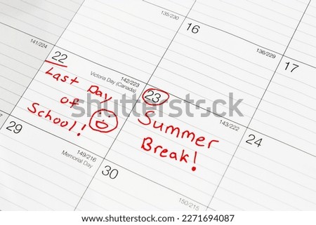 Close up of Summer Break Vacation and last day of school marked on desk calendar planner in the month of May