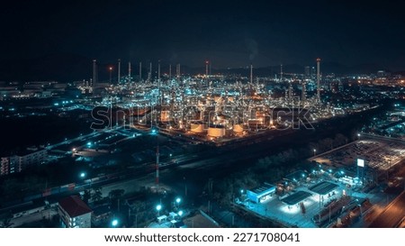 business and industrial area production plant or refinery crude oil and gas for transportatioon and export, aerial photography at night scene from drone,