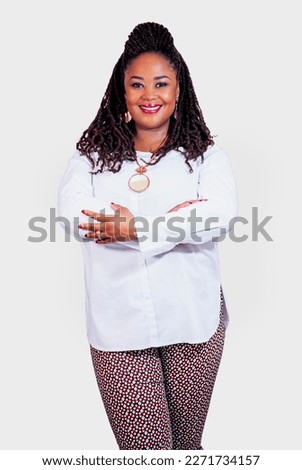 Beautiful black business woman with braided hair in a clean space wearing African attire.