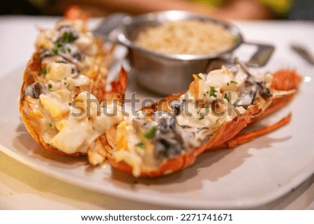 Plated Lobster Thermidor rich in flavor Royalty-Free Stock Photo #2271741671