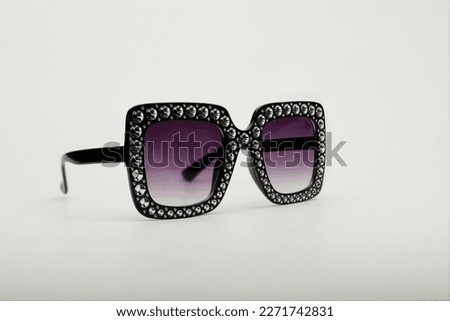 large sunglasses with rhinestones on white background Royalty-Free Stock Photo #2271742831