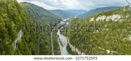 Panorama of a mountain river flowing through the gorge
