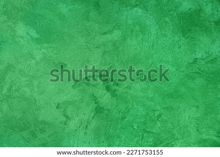 Green abstract background with place for text, texture pearl green background for design, text, advertising, decorative plaster texture for walls.