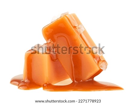 Delicious candies with caramel sauce and sea salt isolated on a white background Royalty-Free Stock Photo #2271778923