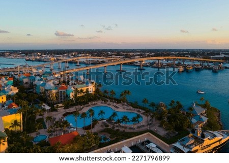 Harborside Villas at sunset aerial view and Paradise Island Bridge at Nassau Harbour, from Paradise Island, Bahamas. Royalty-Free Stock Photo #2271796899