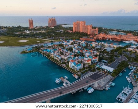 Harborside Villas aerial view at sunset with Atlantis Hotel at the background at Nassau Harbour, from Paradise Island, Bahamas. Royalty-Free Stock Photo #2271800517