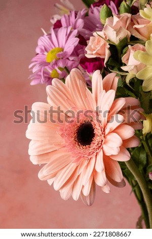 Abstract floral wallpaper with fresh gerbera daisy, roses and chrysantemum.