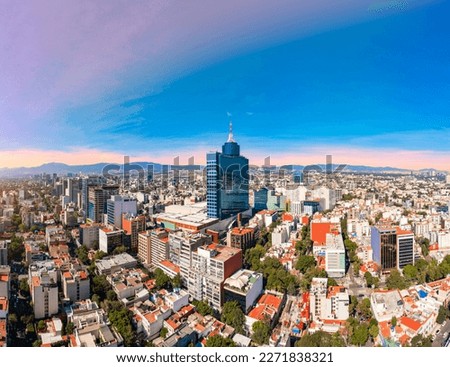 Panoramic aerial view of the iconic building of the World Trade Center in Mexico City on a day with a beautiful sunset Royalty-Free Stock Photo #2271838321
