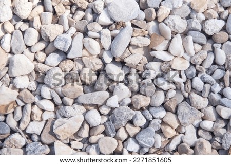 
Small rocks on floor frevement in garden top view background