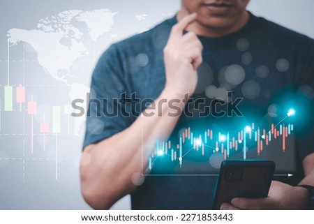 planning and strategy, stock, business growth, progress or success concept, businessman or trader showing growing virtual hologram stocks on mobile, invest in stock market trading or assets digital