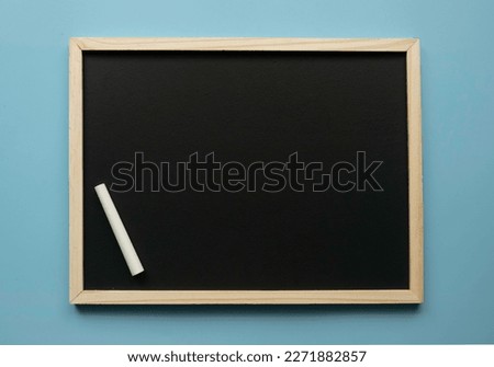 Empty chalkboard with chalk. Copy space.