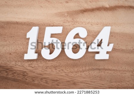 White number 1564 on a brown and light brown wooden background.