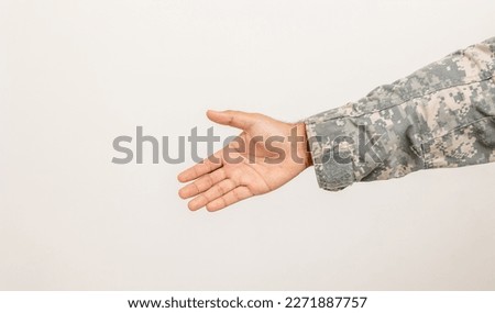 Make peace with hand. Palm up sign. Commander Army soldier military defender of the nation in uniform handshake shot on studio isolated white background. Asian man special forces soldier
