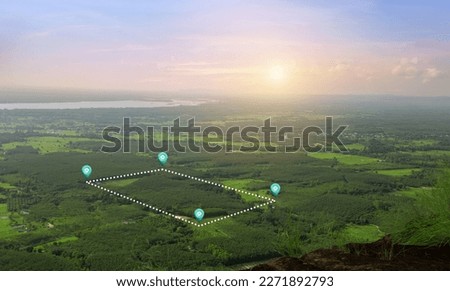 Land in aerial view including real estate landscape, green field, agriculture plant, pin location icons for housing department, housing, development, own, sell, rent, buy or investment. Royalty-Free Stock Photo #2271892793