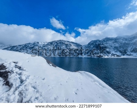 Tsomgo Lake, also known as Tsongmo Lake or Changgu Lake, is a glacial lake in the East Sikkim district of the Indian state of Sikkim, some 40 kilometres (25 mi) from the capital Gangtok. Located at an Royalty-Free Stock Photo #2271899107