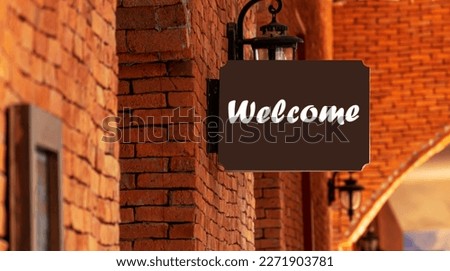 Outdoor brown sign with message Welcome